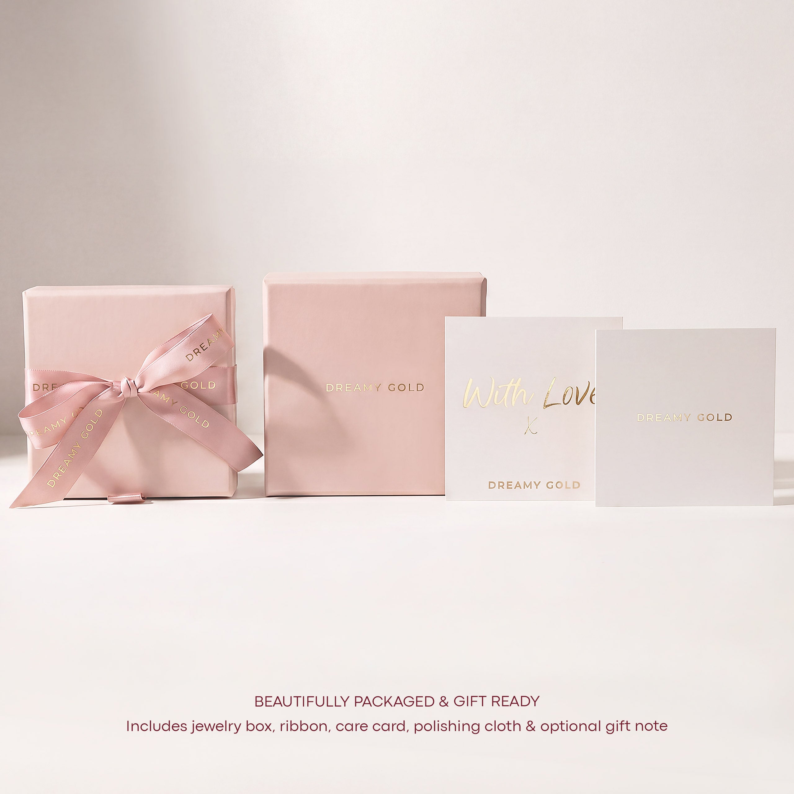 dreamy gold jewelry box packaging with ribbon jewelry care card and gift note